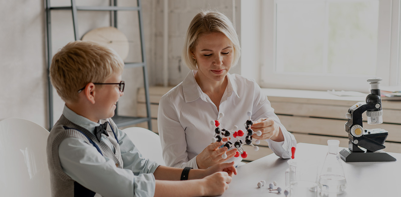 Female science tutor in Glendale studying chemistry with student